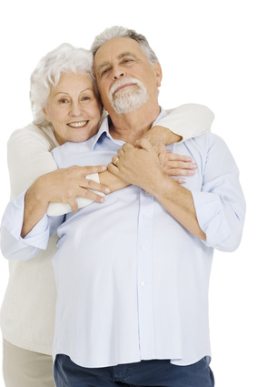 Elderly couple embracing each other