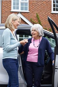 Caregiver Driving Elderly Womann