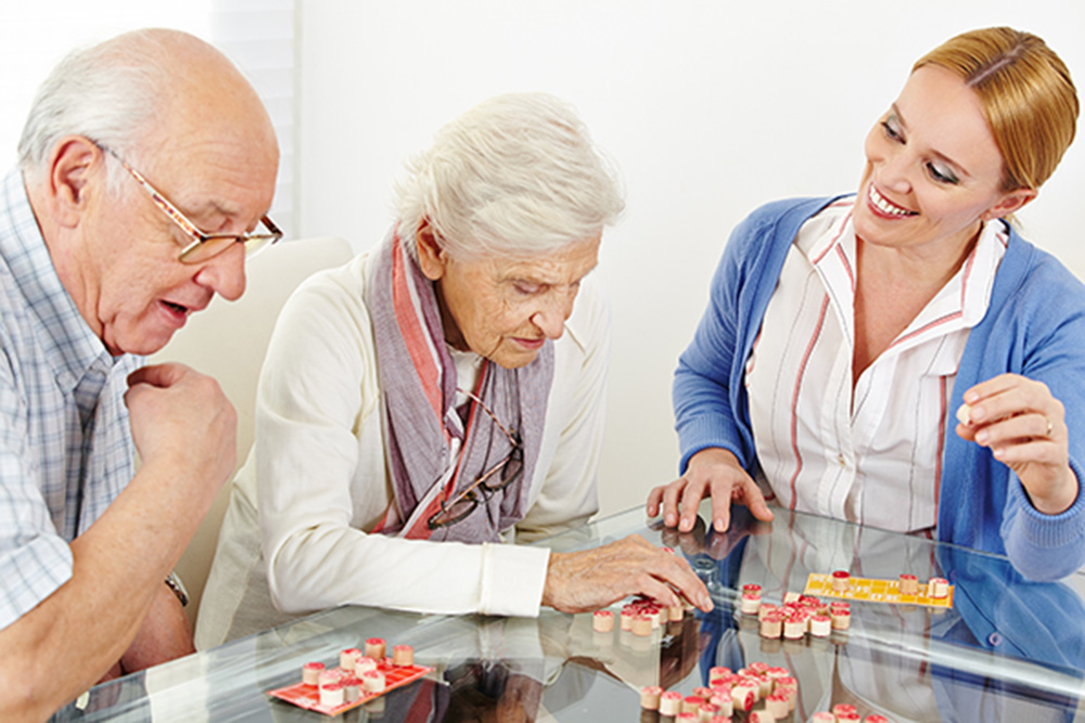 York, PA Dementia Patients Doing Puzzle Activity with Caregiver