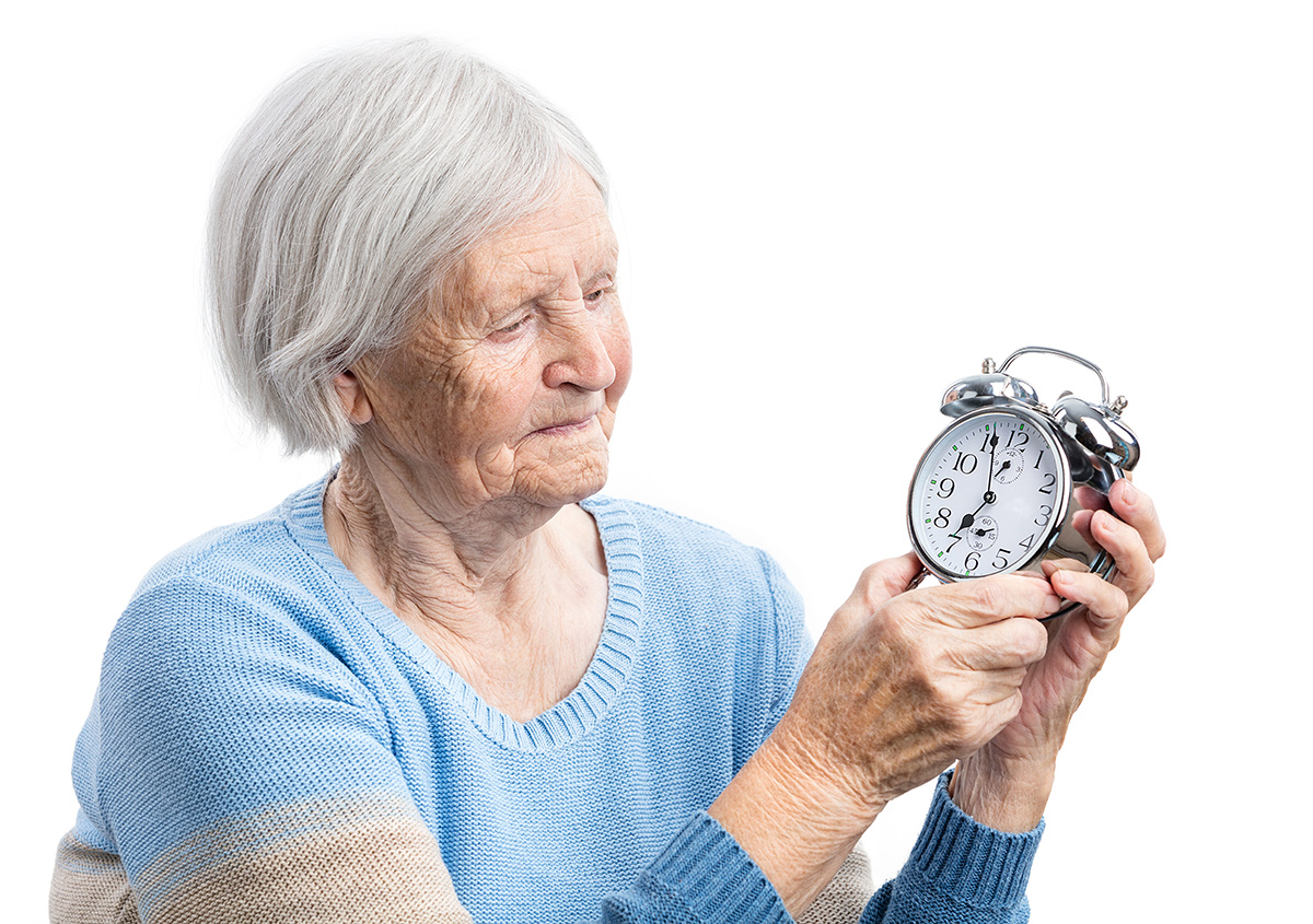 Elderly Woman Holding Clock