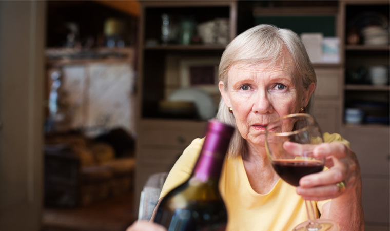 Elderly woman struggling with alcoholism 